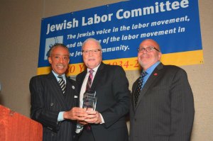 (l-r) Rev. Al Sharpton, President of the National Action Network; Lee Saunders, President of the American Federation of State, County and Municipal Employees; and JLC President Stuart Appelbaum at the JLC's awards dinner in New York, June 19th. (Miller Photography)